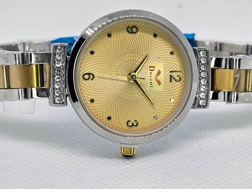 ساعة نسائية ميناء دائري ذهبي و سوار ذهبي مفصص