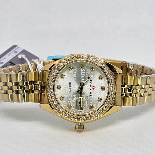 ساعة نسائية ميناء دائري رصاصي مفصص و سوار ذهبي