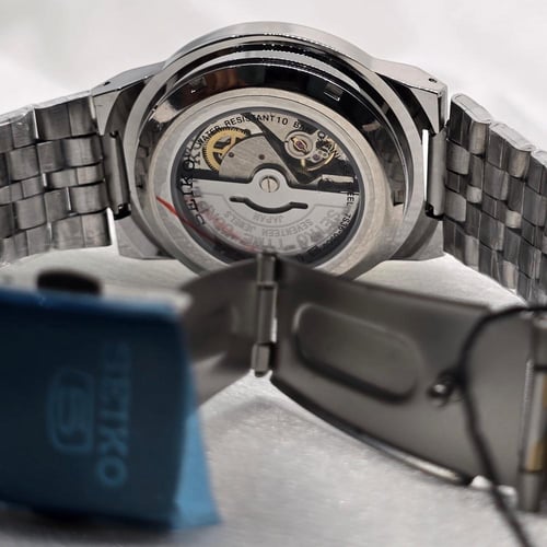 ساعة SEIKO اوتوماتيك رجالي اطار رمادي مخطط ذهبي