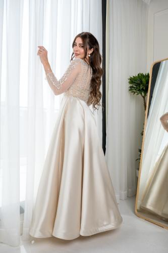 فستان سهرة سكري باكمام طويلة شفافة