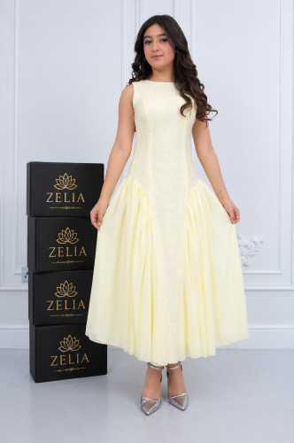 The perplexing milestone dress is soft in lemon color