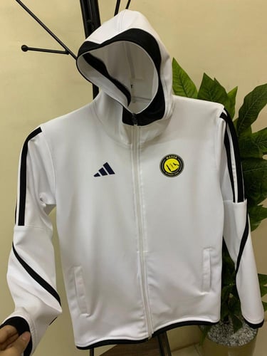 جاكيت شتوي أبيض نادي النصر الشكل الجديد 2026 تصميم...