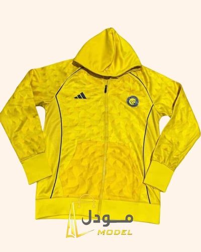 جاكيت شتوي نادي النصر الأصفر الذهبي 2026 تصميم رسم...