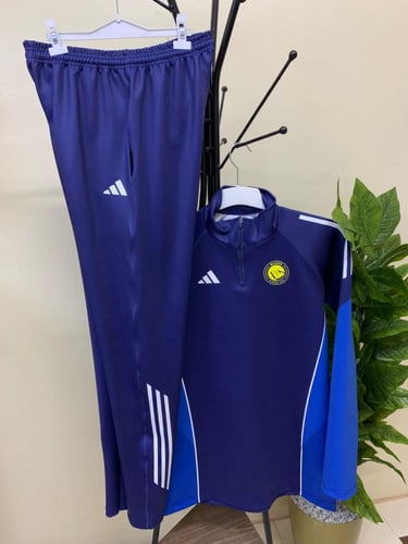 طقم سويتر تمارين نادي النصر الشتوي الكحلي 2026 تصم...