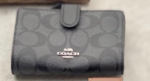 محفظة coach