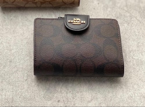 محفظة coach