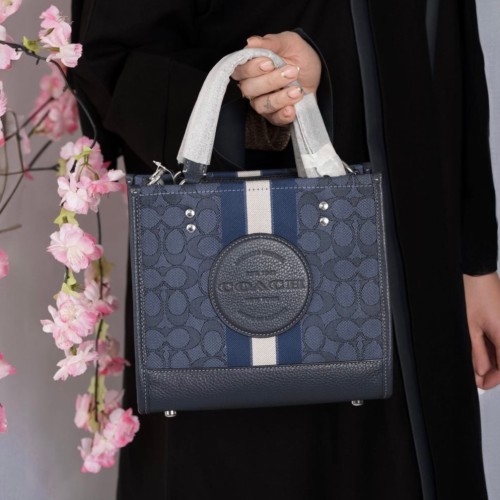 شنطة coach