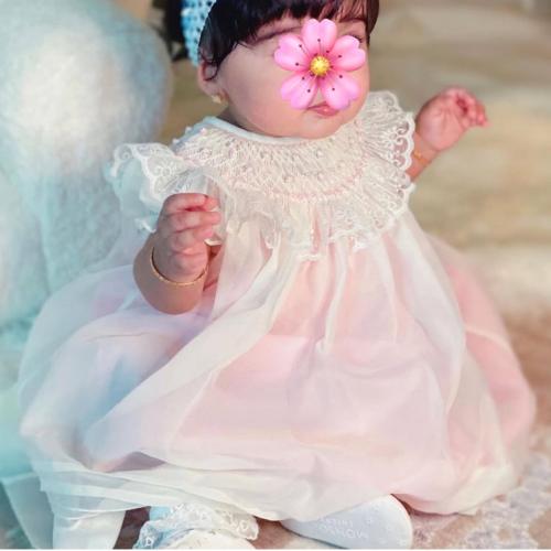 فستان مولوده بتطريز سموك