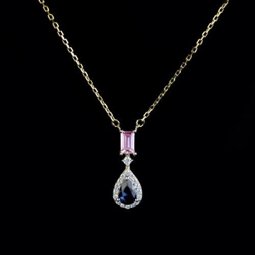 Silver pendant with blue zircon and gold bank from...