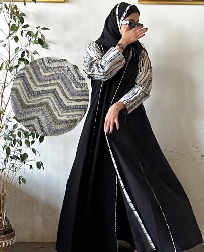 The abaya will be made with the new fabric shown in the picture, and the base of the abaya is black.