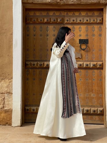 A loose abaya and a head covering