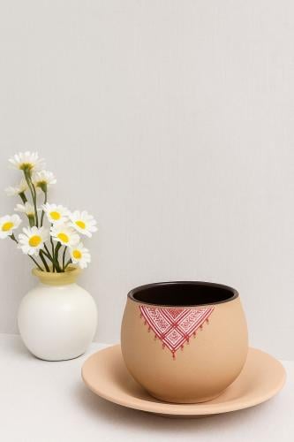 كوب فخار مع صحن