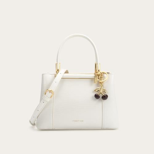 شنطة نسائية بمقاس متوسط باللون الأبيض