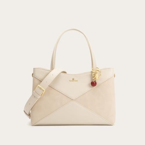 شنطة نسائية باللون المشمشي