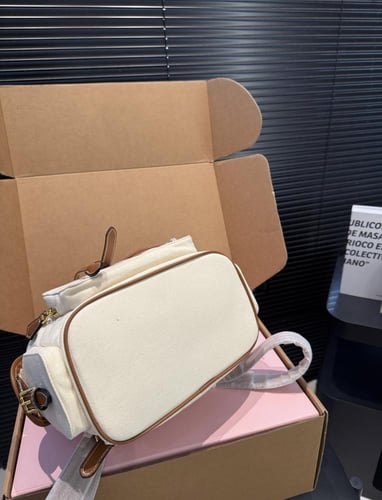 Miu miu Canvas Backpacks حقيبة ظهر ( بيج )