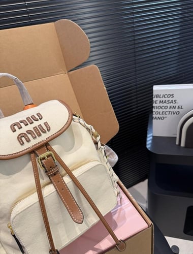 Miu miu Canvas Backpacks حقيبة ظهر ( بيج )