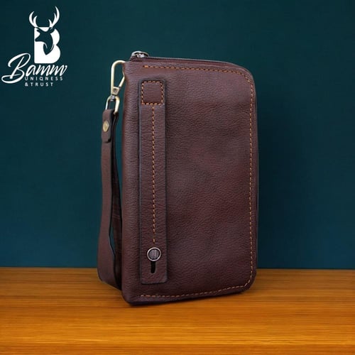 شنطة يد رجالية من الجلد الطبيعي - متعددة الاستخدام...