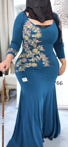 A turquoise dress, luxurious style