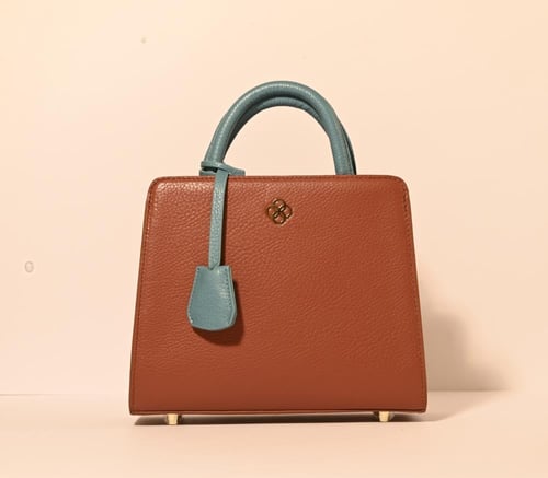 حقيبة ( قوس) باللون الجملي و التركواز