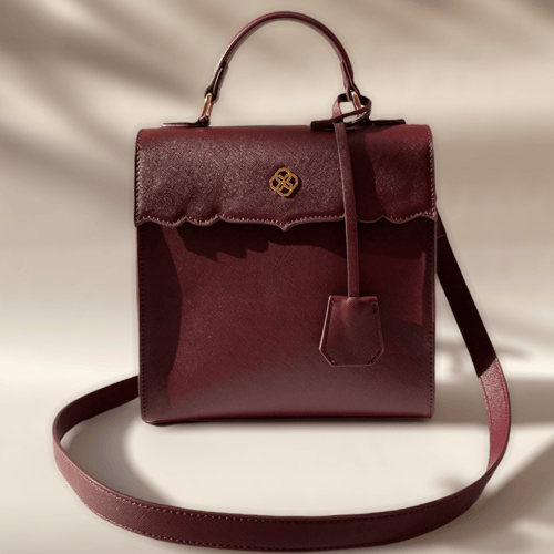 حقيبة (مرزم) باللون العنابي