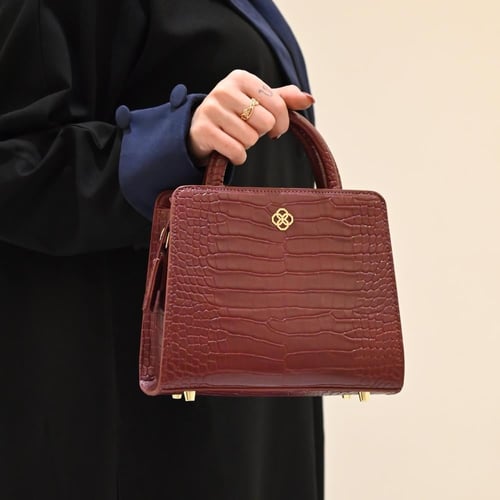 حقيبة ( قوس) باللون العنابي