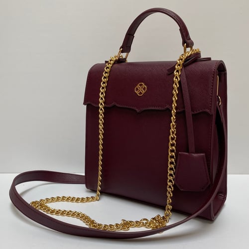 حقيبة (مرزم) باللون العنابي