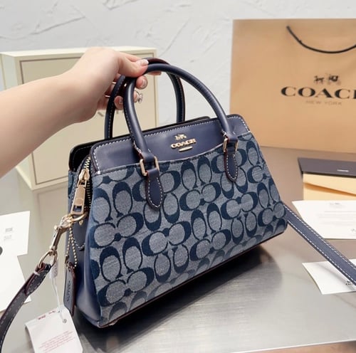 حقيبة كوتش بمقبض ٣ الوان