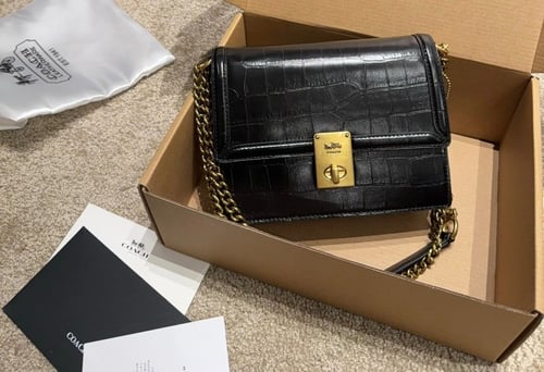 حقيبة كوتش جلد / لونين