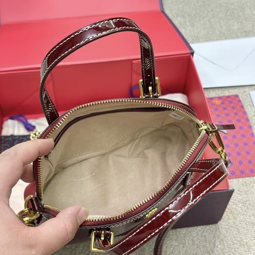 حقيبة توري بورش بعده الوان