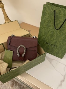 شنطة قوتشي عنابي