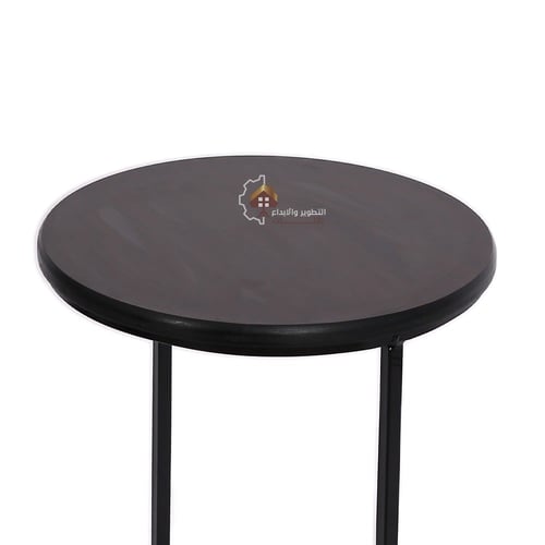 طاولة خدمة لون أسود شكل دائري قاعدة حديد وسطح خشب...