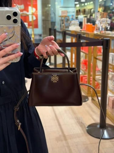 شنطة توري بورش عنابي