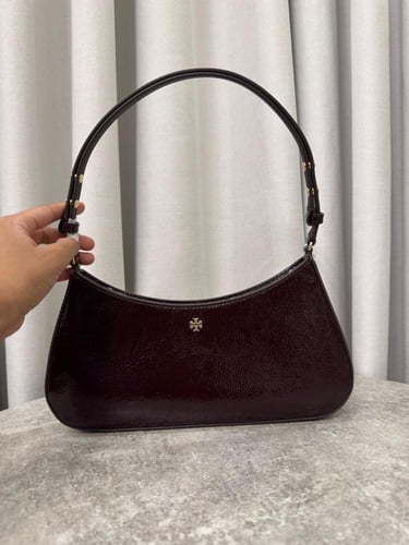 شنطة كتف عنابي توري بورش