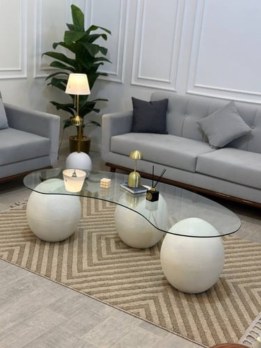 طاولة ضيافة بيضاوي ابيض شكل كور مع سطح زجاج شفاف