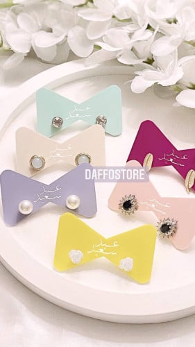 توزيعات حامل اقراط بعبارة عيد سعيد