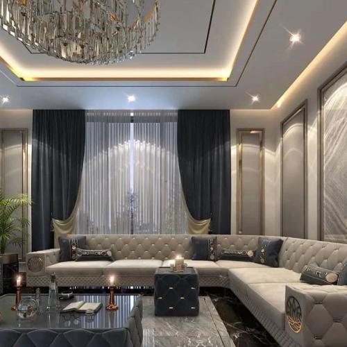 طقم كنب أنيق بلون رمادي مع وسائد زرقاء