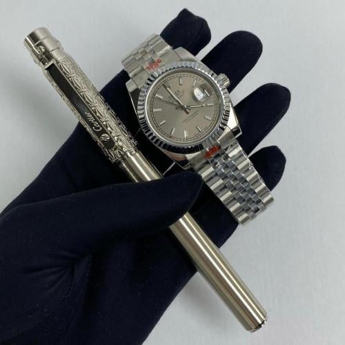 ساعة رولكس و قلم كارتير