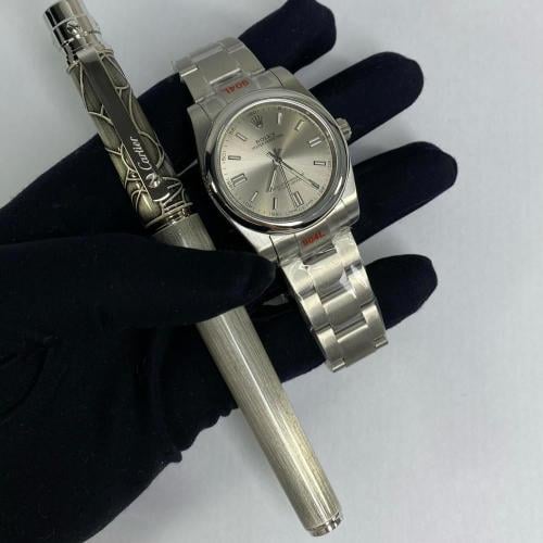 ساعة رولكس و قلم كارتير