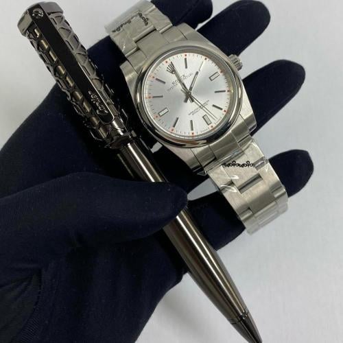 ساعة رولكس و قلم كارتير