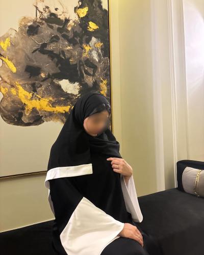 Black A-line abaya with wide white sleeves