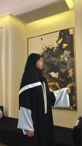 Black A-line abaya with collat and wide baby blue...