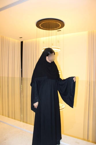 Black A-cut abaya with wide sleeves and silver cry...