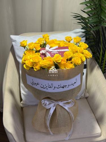 باقة ورد وبوك بالاسم