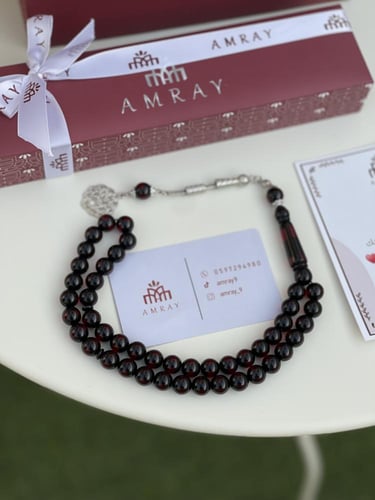 سبحه مخطط نص شفاف اسود محمر