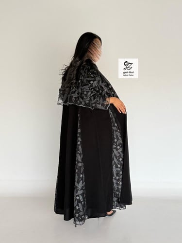 عبايه الغيد كلوش بقماش ملكي اسود بتدخيل تل ترتر
