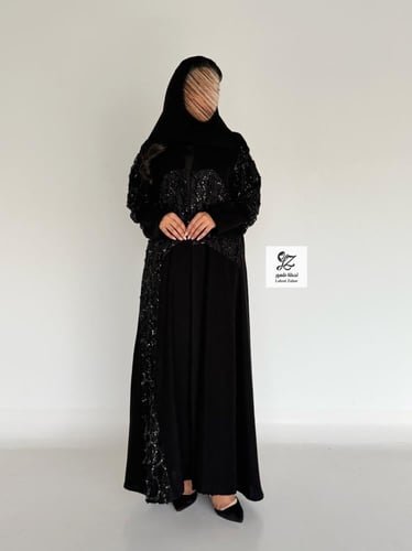 عبايه ضحئ بقماش سيراميك بتدخيل ترتر اسود