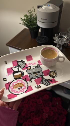 A plate with an espresso cup