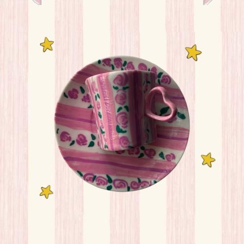 A pink cup in the shape of a heart