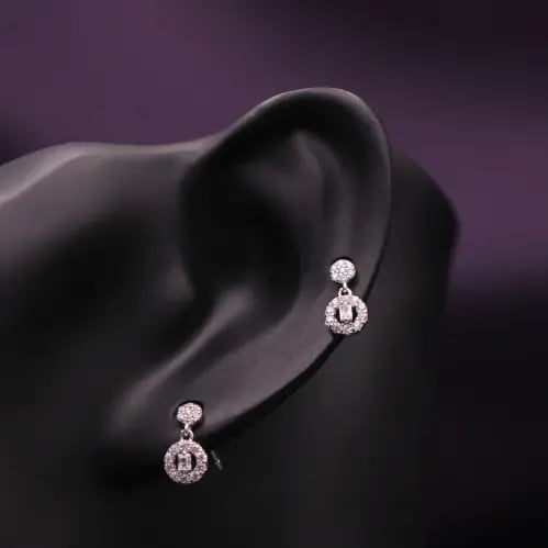 Sterling silver drop earring with a geometric circ...