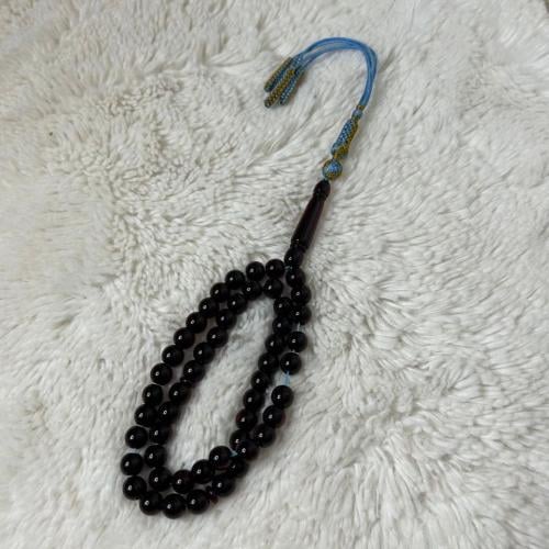 سبحة بكلايت لون عنابي شفاف كركوشة تيفاني